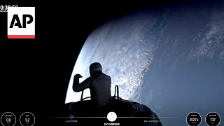 Billionaire steps out of SpaceX capsule for first private spacewalk hundreds of miles above Earth [upl. by Obadiah]