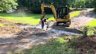 Installing a concrete culvert with flares installculvert driveways compactingfooter [upl. by Eatnuahc]