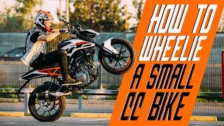 How to wheelie a small cc bike  RokON VLOG 25 [upl. by Leonor]