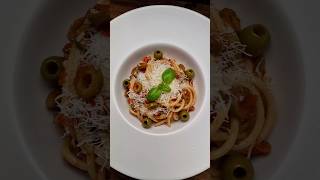 Bucatini pasta with tomatoes olives garlic and Grana Padano cheese [upl. by Tnattirb]